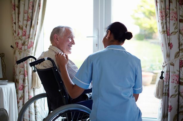 PROD-Nurse-talking-to-elderly-man-in-a-care-home